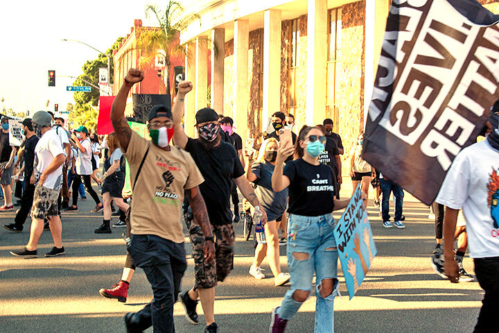 Black Lives Matter supporters march past city hall.